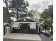 Charming house exterior with a boat dock and a beautifully decorated wall with greenery at 6001-Z55 South Kings Hwy., Myrtle Beach, SC 29575