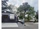 Charming house exterior with water access, boat dock, and lush surrounding trees at 6001-Z55 South Kings Hwy., Myrtle Beach, SC 29575