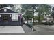 Charming house exterior with water access, boat dock, and beautiful surrounding trees at 6001-Z55 South Kings Hwy., Myrtle Beach, SC 29575