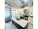 Bright kitchen features stainless steel appliances, island with sink and view of the dining area at 6001-Z55 South Kings Hwy., Myrtle Beach, SC 29575