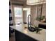 Kitchen featuring quartz countertops, island with sink, and a dining nook beyond at 6001-Z55 South Kings Hwy., Myrtle Beach, SC 29575