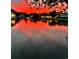 Sunset on the river reflecting beautifully off the water, with trees and houses silhouetted at 6001-Z55 South Kings Hwy., Myrtle Beach, SC 29575
