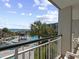 Scenic balcony view overlooking pool, ocean, and well-maintained grounds with tropical landscaping at 601 Retreat Beach Circle # 215, Pawleys Island, SC 29585