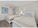Bright bedroom featuring two beds, neutral decor, and a tranquil ambiance for restful nights at 601 Retreat Beach Circle # 215, Pawleys Island, SC 29585