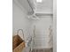 A well-organized closet with shelves, hanging space, and wood-look flooring at 601 Retreat Beach Circle # 215, Pawleys Island, SC 29585