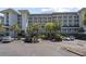 Beautiful condo building with parking and manicured landscaping features multiple floors and beach access at 601 Retreat Beach Circle # 215, Pawleys Island, SC 29585