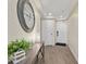Inviting hallway with wood flooring, a console table, and recessed lighting showcases a welcoming entrance at 601 Retreat Beach Circle # 215, Pawleys Island, SC 29585