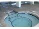 Intimate hot tub area with brick surround and metal handrails at 601 Retreat Beach Circle # 215, Pawleys Island, SC 29585