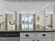 Open kitchen view into dining area and balcony with beautiful ocean view at 601 Retreat Beach Circle # 215, Pawleys Island, SC 29585