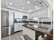Modern kitchen featuring stainless steel appliances, granite counters, and white cabinetry at 601 Retreat Beach Circle # 215, Pawleys Island, SC 29585