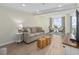 Cozy living room with comfortable seating, large windows, and inviting decor offers an enjoyable ambiance at 601 Retreat Beach Circle # 215, Pawleys Island, SC 29585