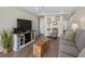 Well-lit living room featuring cozy seating, stylish decor, and natural light perfect for relaxation at 601 Retreat Beach Circle # 215, Pawleys Island, SC 29585