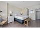 Bright main bedroom featuring a king bed, nightstands, and coastal decor at 601 Retreat Beach Circle # 215, Pawleys Island, SC 29585