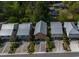 Aerial view of charming coastal homes with metal roofs and landscaped yards at 93 Weatherboard Ct., Pawleys Island, SC 29585
