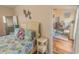 Comfortable bedroom with coastal decor, offering a serene space with easy access to an adjacent bathroom and living area at 93 Weatherboard Ct., Pawleys Island, SC 29585