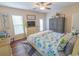 Well-lit bedroom featuring a queen bed, coastal decor, and outdoor access for a serene and comfortable living space at 93 Weatherboard Ct., Pawleys Island, SC 29585