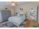 Inviting bedroom with a queen bed, coastal-themed decor, and ample storage, creating a tranquil retreat at 93 Weatherboard Ct., Pawleys Island, SC 29585