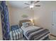 Relaxing bedroom featuring a queen bed, coastal-themed decor, and a ceiling fan for a peaceful retreat at 93 Weatherboard Ct., Pawleys Island, SC 29585