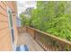 Wooden deck with views of the surrounding lush green forest at 93 Weatherboard Ct., Pawleys Island, SC 29585