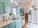 Well-lit kitchen with stainless steel appliances, ample counter space, and view to dining area at 93 Weatherboard Ct., Pawleys Island, SC 29585