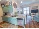Open-concept kitchen featuring stainless steel appliances and seamless flow to the living area at 93 Weatherboard Ct., Pawleys Island, SC 29585