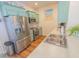 Bright kitchen with stainless steel appliances, tile backsplash, and ample counter space at 93 Weatherboard Ct., Pawleys Island, SC 29585