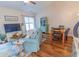 Cozy living area featuring comfortable seating, bright lighting, and dining area at 93 Weatherboard Ct., Pawleys Island, SC 29585