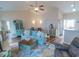 Inviting living room with vaulted ceilings, beach-themed decor, and ample seating for relaxation and entertainment at 93 Weatherboard Ct., Pawleys Island, SC 29585