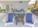 Cozy outdoor space with comfortable seating, a grill, and access to the home's backyard at 93 Weatherboard Ct., Pawleys Island, SC 29585