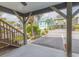 View of street from covered outdoor space featuring wooden support beams at 93 Weatherboard Ct., Pawleys Island, SC 29585