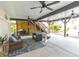 Large covered outdoor space featuring wood ceiling beams and stylish patio furniture at 93 Weatherboard Ct., Pawleys Island, SC 29585