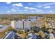 Breathtaking aerial shot of the condominium overlooking the serene marsh and lush green landscape at 9547 Edgerton Dr. # 702, Myrtle Beach, SC 29572