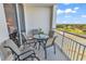 Enjoy beautiful views from the balcony with seating for four around a glass table at 9547 Edgerton Dr. # 702, Myrtle Beach, SC 29572