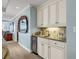 Convenient bar area with custom cabinets, mini-fridge and granite countertops at 9547 Edgerton Dr. # 702, Myrtle Beach, SC 29572