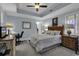 Cozy bedroom with a wooden bed frame, a desk, and plenty of natural light at 9547 Edgerton Dr. # 702, Myrtle Beach, SC 29572