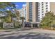 Stately entrance to The Pointe featuring lush landscaping and secure gated access at 9547 Edgerton Dr. # 702, Myrtle Beach, SC 29572
