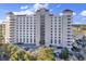 Stunning high-rise condominium building boasting meticulous architectural details and beautiful landscaping at 9547 Edgerton Dr. # 702, Myrtle Beach, SC 29572