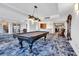 Spacious game room featuring a pool table, seating area, and stylish lighting at 9547 Edgerton Dr. # 702, Myrtle Beach, SC 29572