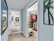 Hallway view into bathroom and walk-in closet, with calming color scheme at 9547 Edgerton Dr. # 702, Myrtle Beach, SC 29572