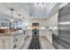 Spacious open kitchen with granite countertops, center island, stainless steel appliances and custom lighting at 9547 Edgerton Dr. # 702, Myrtle Beach, SC 29572