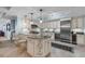 Bright kitchen with granite countertops, a kitchen island, stainless steel appliances, and custom cabinets at 9547 Edgerton Dr. # 702, Myrtle Beach, SC 29572