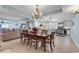 Open-concept living room and kitchen featuring elegant dining set and neutral decor at 9547 Edgerton Dr. # 702, Myrtle Beach, SC 29572