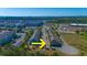 Aerial view of neighborhood townhomes, lake, retail development, and surrounding area at 105 Villa Mar Dr. # C-1, Myrtle Beach, SC 29579