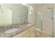 Bathroom featuring a double vanity, granite countertop, and a glass-enclosed shower at 105 Villa Mar Dr. # C-1, Myrtle Beach, SC 29579