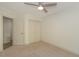 Bedroom with a ceiling fan, closet, and access to a bonus room at 105 Villa Mar Dr. # C-1, Myrtle Beach, SC 29579