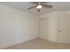 Bright bedroom with a ceiling fan, neutral carpet, and a double door closet at 105 Villa Mar Dr. # C-1, Myrtle Beach, SC 29579