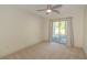 Bedroom featuring sliding glass doors to the patio and a ceiling fan at 105 Villa Mar Dr. # C-1, Myrtle Beach, SC 29579