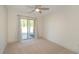 Bedroom featuring sliding glass doors to the patio and a ceiling fan at 105 Villa Mar Dr. # C-1, Myrtle Beach, SC 29579