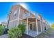 Exterior view of a two-story house with a balcony and covered patio at 105 Villa Mar Dr. # C-1, Myrtle Beach, SC 29579