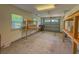 Spacious garage with natural light, storage shelves, and garage door at 105 Villa Mar Dr. # C-1, Myrtle Beach, SC 29579